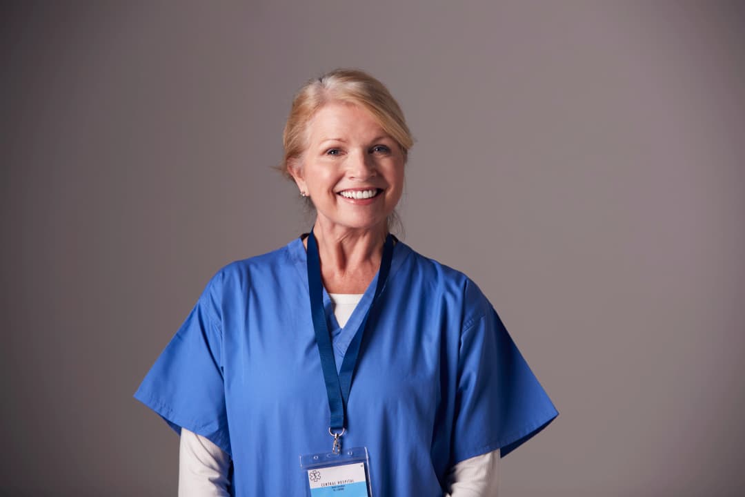 Nurse reviewing medical-surgical board exam preparation materials on a tablet